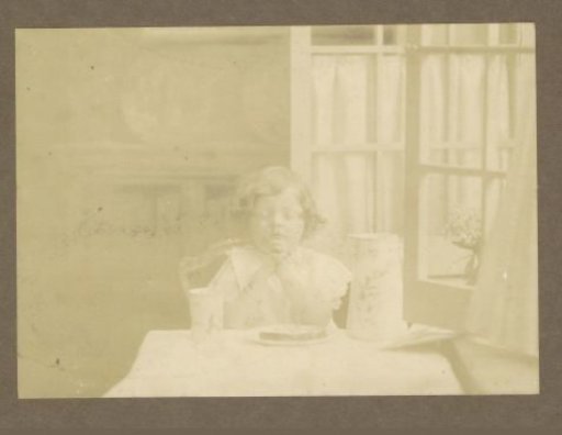 Portrait of a Girl Praying at a Table