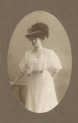 Portrait of a woman in a dress with a hat