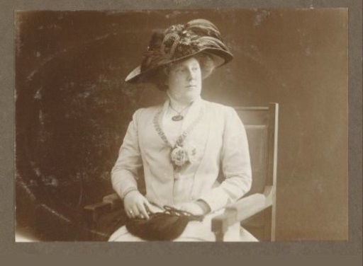 Portrait of a daughter Vermeulen, seated with a feathered hat and corset