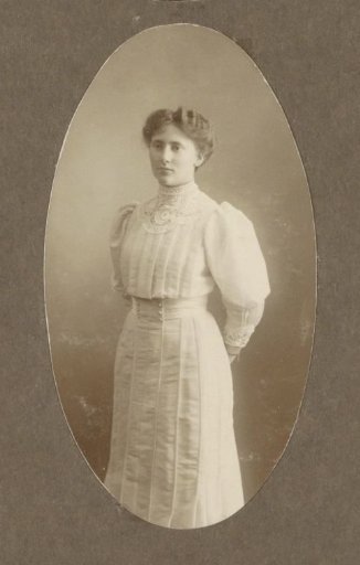 Portrait of Flop Vermeulen in a dress with a lace collar