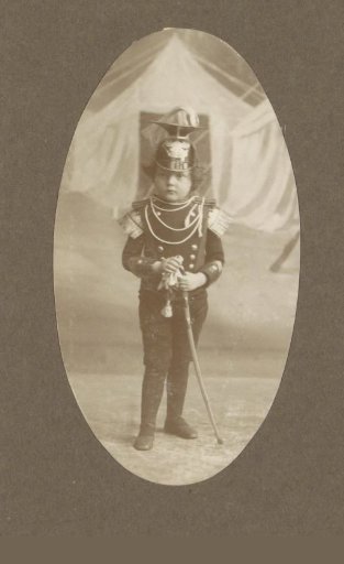 Portrait of a Child in Military Uniform with a Saber