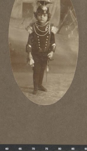 Portrait of a Child in Military Uniform with a Saber