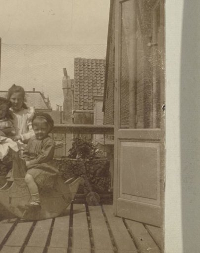 Group portrait of four children of the Vermeulen family on a balcony