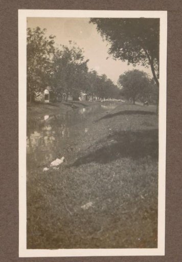 View of a waterway with a bridge, possibly in Singkawang on Borneo