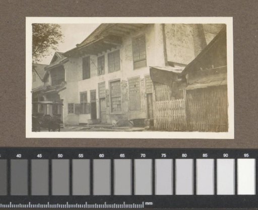 Street with houses and a cart, presumably in Singkawang on Borneo