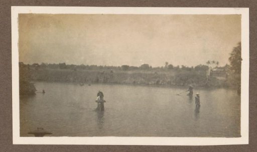 Fishermen Standing in Shallow Water in the Dutch East Indies