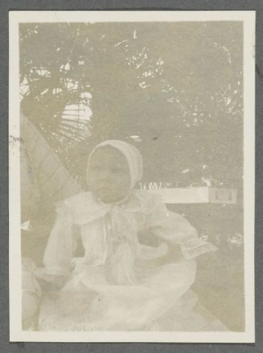 Portrait of baby Tiny Kleiterp in a garden in Pangka on Java