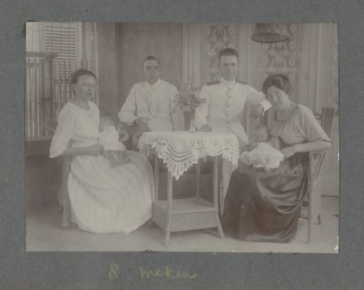 Group portrait of two couples with babies, including Klaas Kleiterp and his wife Tine Kleiterp-Vermeulen with eight-week-old Klaas (right) in Malang