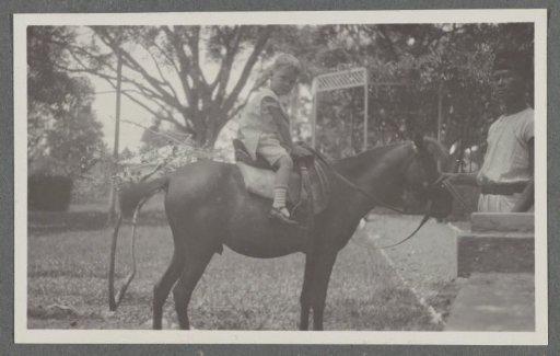 Klaas Kleiterp on a horse held by a Javanese man in Batoedjadjar