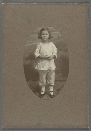Portrait of Tiny Kleiterp as a toddler in a suit with three-quarter sleeves and trousers