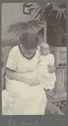 Four-and-a-half-month-old baby Klaas Kleiterp in the arms of his mother Tine Kleiterp-Vermeulen in Malang