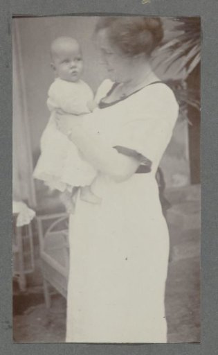 Four-and-a-half-month-old baby Klaas Kleiterp in the arms of his mother Tine Kleiterp-Vermeulen in Malang