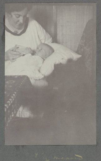 Four-and-a-half-month-old baby Klaas Kleiterp receiving a bottle from his mother Tine Kleiterp-Vermeulen in Malang