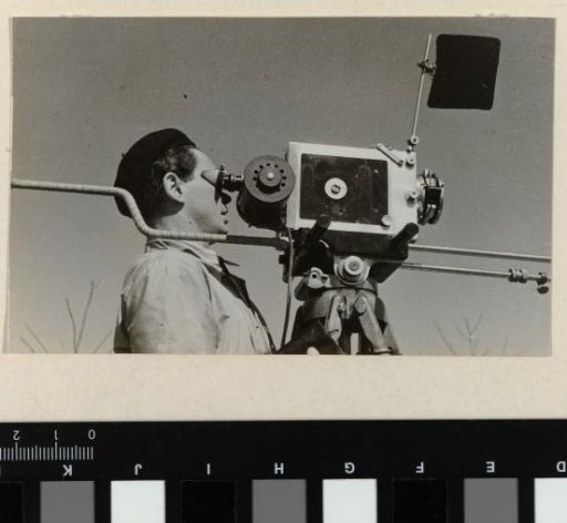 Joris Ivens during the making of his film 'The 400 Million' in China | Cameraman John Fernhout installing a camera in China