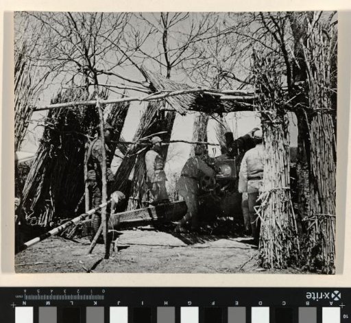 Soldiers Operating a Concealed Cannon, China