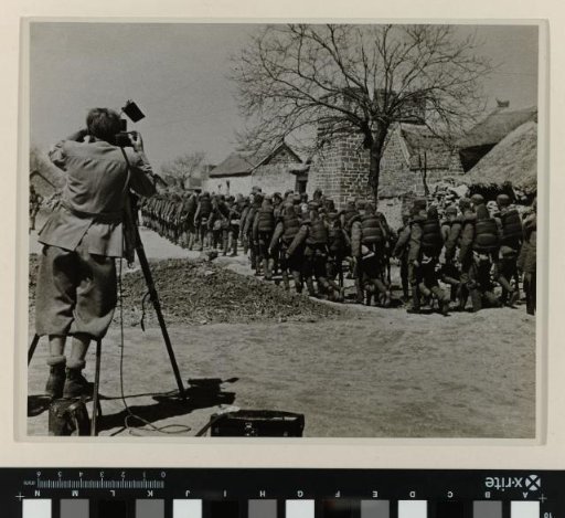 John Fernhout filming marching soldiers, China