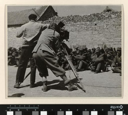 John Fernhout and Joris Ivens filming soldiers, China