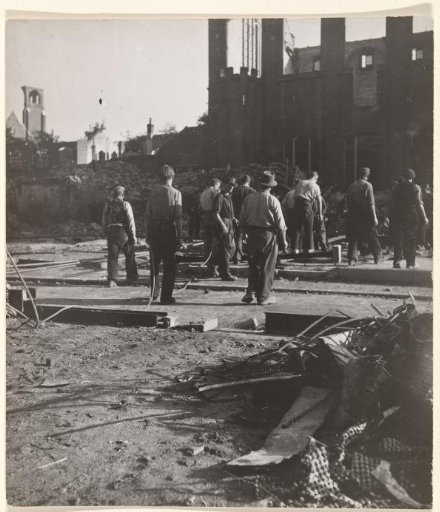 Men clearing rubble in the devastated Arnhem