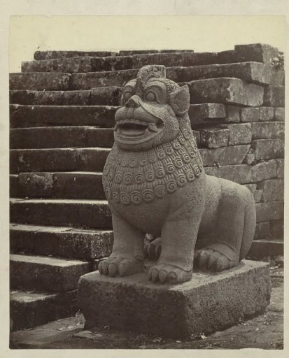 Statue in the form of a lion at the foot of a staircase at the Borobudur.