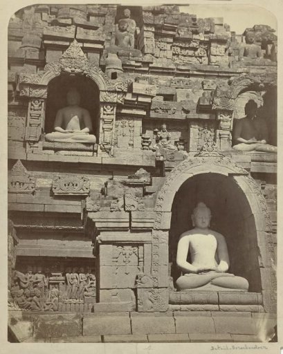 Four niches in the Borobudur containing Buddha figures in dhyanamudra.