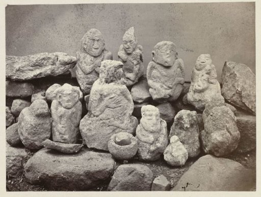 Sacrificial place with eight ancestor sculptures, some holding a child. Mount Aki0aki, Kuningan district, West Java province, 14th-16th century.