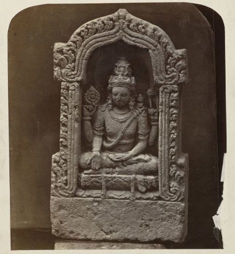 Four-armed Shiva in a niche, holding a rosary and a flywhisk.