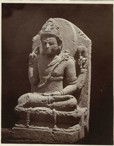 Four-armed Shiva, one arm (likely displaying the varada mudra) broken off. Dieng Plateau, Wonosobo district, Central Java province, 9th century.