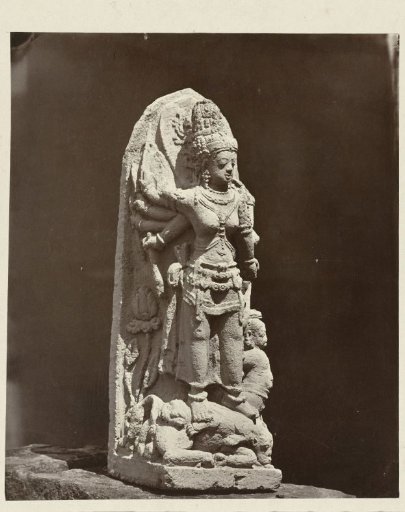 Ten-armed Durga slaying the demon Mahisha, upper right arm missing. Dieng Plateau, Wonosobo district, Central Java province, 9th century.