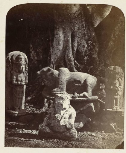 Stone sculptures from East Java exhibited at the Botanical Gardens in Bogor: deification statue in the form of the goddess Parvati; Nandi, male deification statue; and Ganesha. Bogor, Bogor district, West Java province, 13th–14th century.