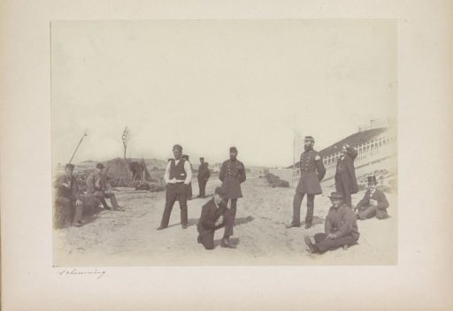 Workers, men in uniform and some well-dressed men in the dunes near the North Sea Canal, near IJmuiden