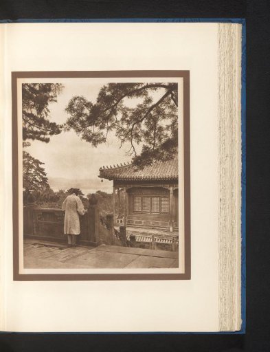 Unknown person at a house overlooking a lake
