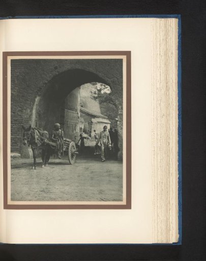 Unknown persons with a horse and carriage at a gate