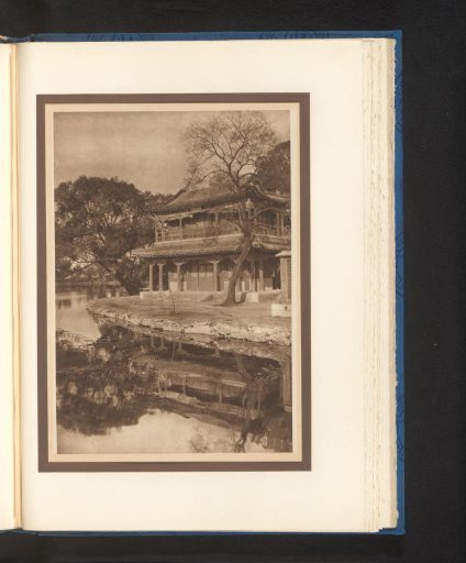 View of a building with a terrace by the water