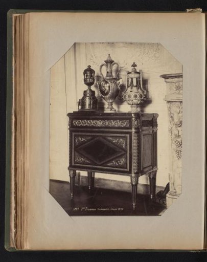 Wooden cabinet in Louis XVI style with gilded ornaments
