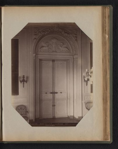 Two doors with carved panels, also ornaments in the framework above the two doors
