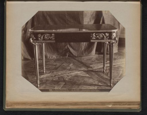 Wooden table with gilded elements