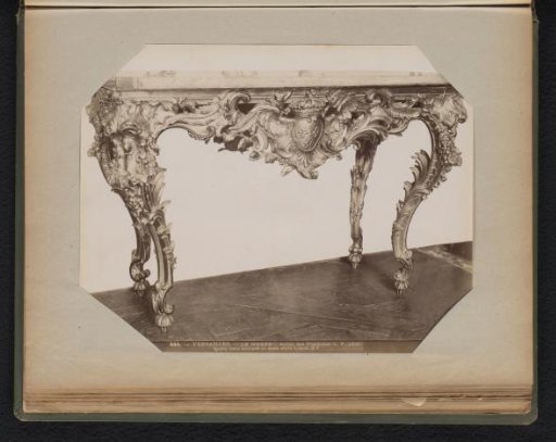 Gilded wooden table with carved base