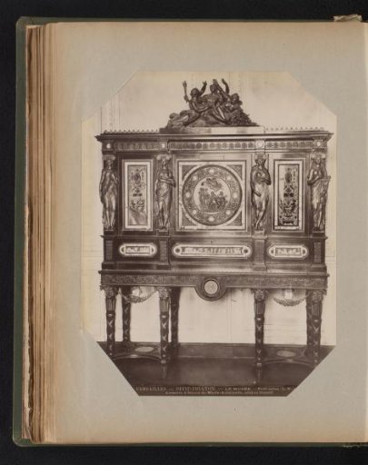 Mahogany cabinet with ornaments