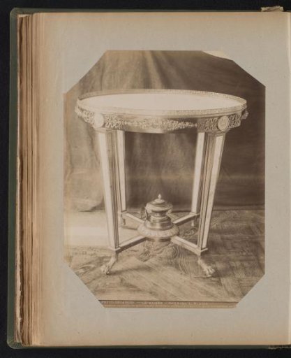 Mahogany table with garlands and medallions on the table edge