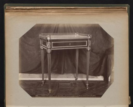 Mahogany table with gilded ornaments and top