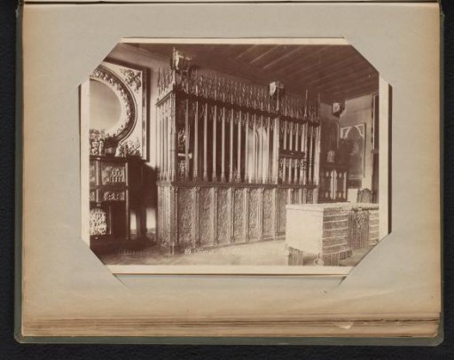 Wooden fence with rails and woodcarving