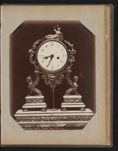 Clock whose mechanism rests on a bronze rod