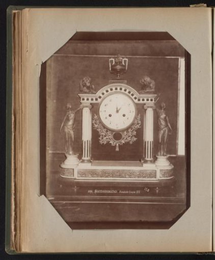 Clock whose mechanism hangs between two pillars