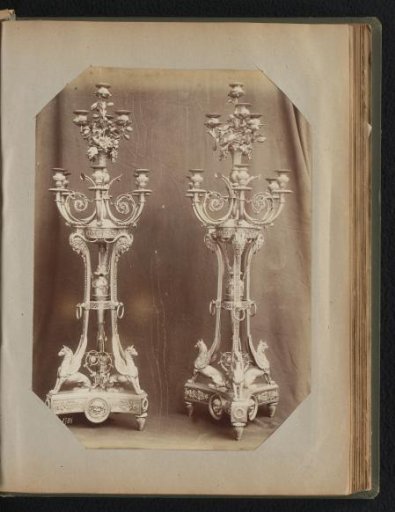 Two decorated ten-armed bronze candelabra with floral and mythological decoration