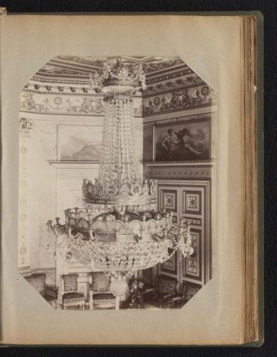 Bronze chandelier with ornaments and crystal lines and decorations