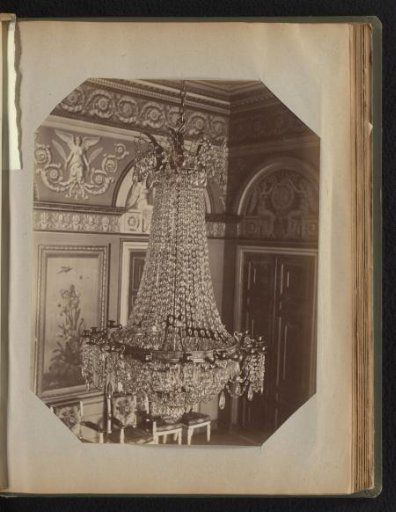 Bronze chandelier hung with crystal strands and ornaments