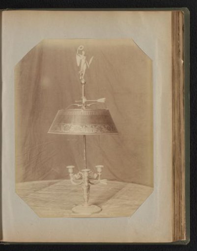 Three-armed bronze candelabrum covered with a canopy
