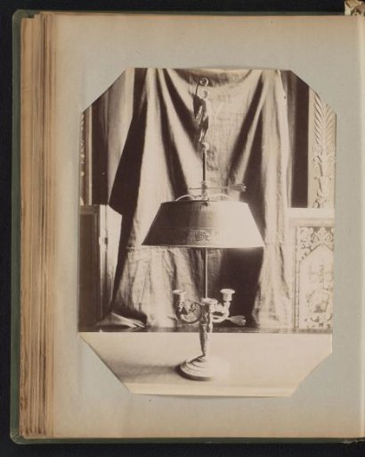 Three-armed bronze candelabrum covered with a canopy