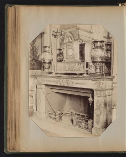 Decorated mantelpiece with a three-part overmantel