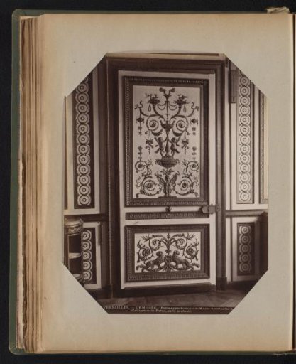 Wooden door with bronze decoration in the two panels